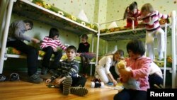 Children play in their bedroom at an orphanage in the southern Russian city of Rostov-na-Donu.