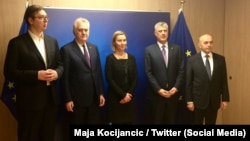 Left to right: Serbian Prime Minister Aleksandar Vucic; Serbian President Tomislav Nikolic; EU foreign policy chief Federica Mogherini; Kosovar President Hashim Thaci; and Kosovar Prime Minister Isa Mustafa in Brussels on February 1