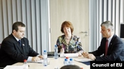 European Union foreign-policy chief Catherine Ashton (center) met with the Serbian and Kosovar prime ministers, Ivica Dacic (left) and Hashim Thaci, in Brussels.