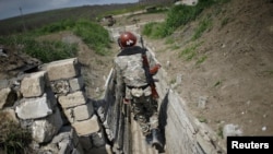 Ethnic Armenian soldiers in a trench close to the border with Nagorno-Karabakh (file photo from 2016)