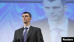 Mikhail Prokhorov addresses supporters at a meeting in Moscow on December 15.