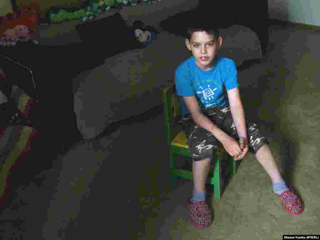 11-year-old Misha was taken into care after his father, an Azeri, was convicted of a crime and deported from Russia.