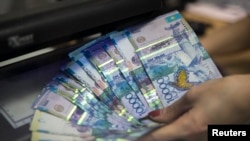 The tenge lost more than one-quarter of its value against the dollar on August 20.