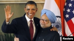 U.S. President Barack Obama (left) shakes hands with Indian Prime Minister Manmohan Singh at a joint news conference in New Delhi today.