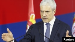 Serbian President Boris Tadic gestures during a news conference in Belgrade on December 30.