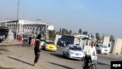 A member of Islamic State secures a street in central Mosul in November.