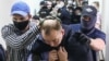 Former Russia journalist Ivan Safronov is escorted to a hearing at a Moscow court on "treason" charges earlier this week. 