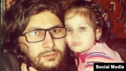 An image from a posting by a Chechen militant of Islamic State's Chechen faction, Katibat al-Aqsa, who calls himself Abu Hamza but previously was known as Ilyas Deniyev, with a child identified as "Khadija," whose face has been pixelated to protect her identity.