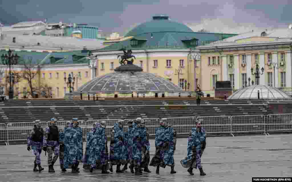 Russian policemen walk on Manezhnaya Square in preparation for a possible opposition rally and prevention of riots in Moscow, April 21, 2021.&nbsp;