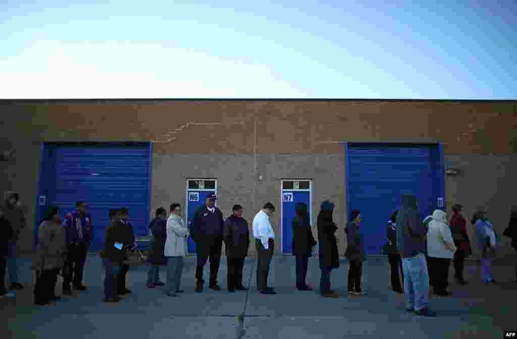 People wait in line to vote at Caroline High School in Milford, Virginia. 