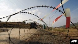 German KFOR troops patrol near a Serb-erected barricade in the village of Zupce, northern Kosovo.