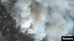 A satellite image homes in on large plumes of smoke near Toropets in Russia's Tver region after a massive Ukrainian drone strike on September 18.