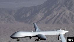 An MQ-1 Predator drone aircraft in flight at an undisclosed location. 