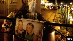 A picture of victims of the fatal Russian MetroJet Airbus A321 crash in Sinai is left next to flowers and candles in memory of the victims of the crash in St. Petersburg.