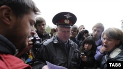 Yevgenia Chirikova (R) at the site of the planned highway, where trees have been felled in Khimki Forest near Moscow