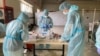 Medical workers in a temporary hospital set up in Bishkek to handle the large number of coronavirus cases