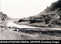 An undated photo showing a section of the cemetery. On the right side of the riverbank is Iran. The Aras River serves as the international border.