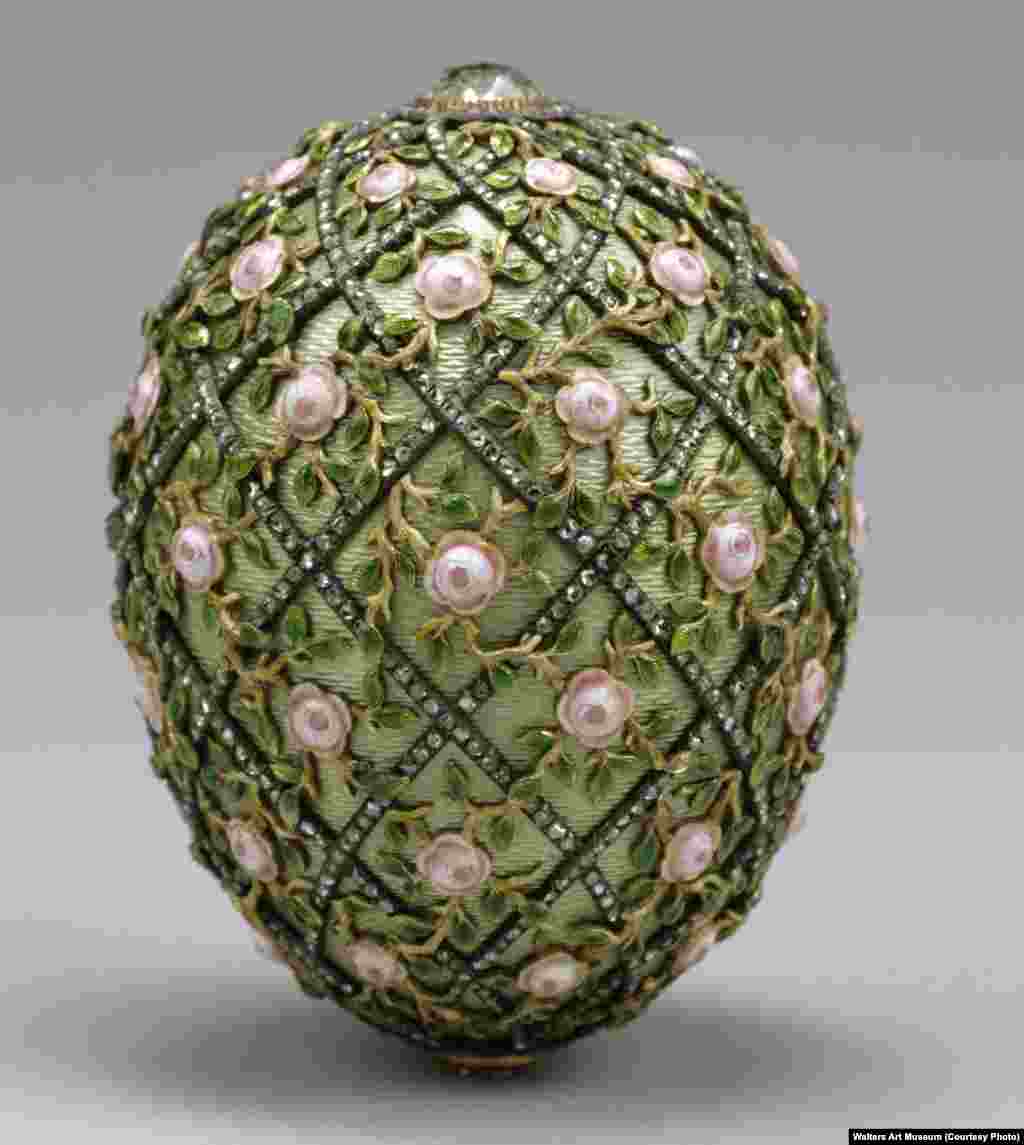 The 7.7-centimeter-tall Rose Trellis Egg, created in 1907 from gold, enamel, and strings of tiny diamonds. As Faberge oversaw the creation of this egg, Russia was reeling from a disastrous war with Japan and the events known as &quot;Bloody Sunday,&quot; in which scores of peaceful protesters were shot dead in front of the tsar&#39;s Winter Palace. &nbsp; &nbsp;