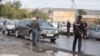 Security forces attend the scene of a bomb attack at a police station in Chechnya on September 16 that killed three people. 