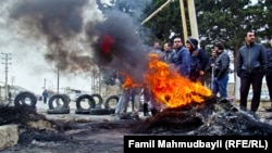 PHOTO GALLERY: Locals brace for more violence the day after clashes between police and an Islamist group left four residents and two police dead in the village of Nardaran outside Baku on November 26. (By Famil Mahmudbeyli of RFE/RL's Azerbaijani Service)