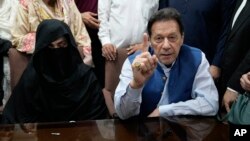 Former Pakistani Prime Minister Imran Khan and his wife, Bushra Bibi (file photo)