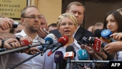 Yulia Tymoshenko talks to the press in front of the court in Kyiv before her arrest.