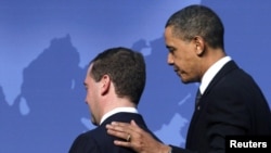 U.S. President Barack Obama greets his Russian counterpart Dmitry Medvedev (left) at the Nuclear Security Summit in Washington, D.C.