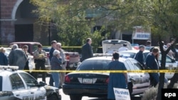 The scene outside a Tucson, Arizona supermarket after the shooting spree that killed at least six people and seriously wounded U.S. Congresswoman Gabrielle Giffords on January 8