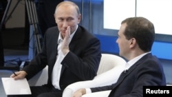 Russia's ruling tandem, Prime Minister Vladimir Putin (left) and President Dmitry Medvedev, are expected to swap jobs in the coming months.