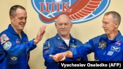 NASA astronauts Richard Arnold (left) and Andrew Feustel (right) with Roscosmos cosmonaut Oleg Artemyev pose for a picture at the Russian-leased Baikonur cosmodrome in Kazakhstan in March 2018.