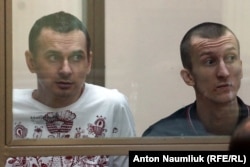 Viktor Medvedchuk says securing the release of jailed Ukrainian film director Oleh Sentsov (left) and Oleksandr Kolchenko (right) may be complicated by the fact that they were convicted of an offense in Crimea, which Russia views as its territory.