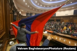 Angry protesters stormed the parliamentary assembly in Yerevan on November 10 after Prime Minister Nikol Pashinian said he had signed an agreement to end the war in Nagorno-Karabakh.