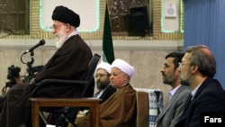 Is Supreme Leader Ayatollah Ali Khamenei's (left) position threatened by the factional battles of President Mahmud Ahmadinejad (second from right) and parliament speaker Ali Larijani (right)?