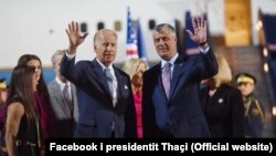 Standing alongside Kosovar President Hashim Thaci (right), U.S. Vice President Joe Biden (left) waves to onlookers upon his arrival in Pristina late on August 16