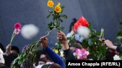 ARMENIA -- Armenians commemorate the anniversary of the Armenian genocide by laying flowers around the eternal flame inside the Armenian genocide memorial in Yerevan, April 24, 2018