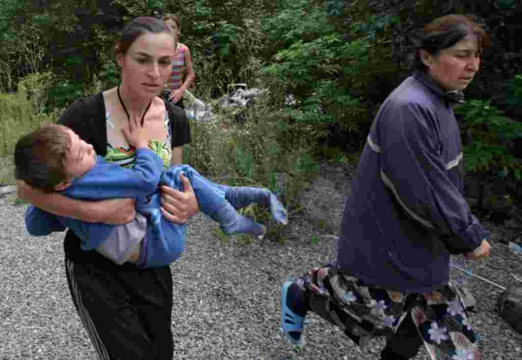 South Ossetians run for shelter in the village of Dzhava as the conflict intensified on August 9. 