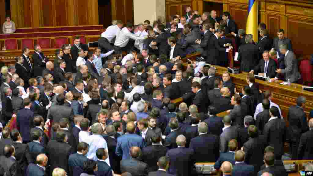 They might have been the first sessions of a new parliament, but Ukraine&#39;s lawmakers were back to their old ways on December 12 and 13 when melees on the chamber floor interrupted the proceedings.