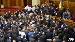 PHOTO GALLERY: Fistfights broke out in Ukraine's new parliament, the Verkhovna Rada, in successive sessions on December 12 and 13, as opposition lawmakers tried to block access to the podium following disputed elections and rumors of defections poisoning the air. (19 PHOTOS)