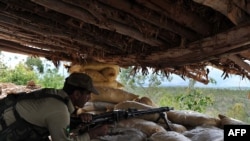 A soldier on guard in a bunker in Pakistan's Kurram tribal district, near the Afghan border