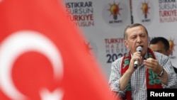 Turkish Prime Minister Tayyip Erdogan addresses Justice and Development Party (AKP) supporters during an election rally in Diyarbakir on June 1.