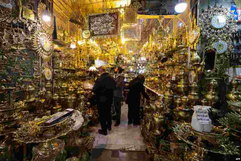 People shop in a store at the Grand Bazaar in the Iranian capital, Tehran. 