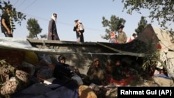 Internally displaced Afghans from northern provinces who fled fighting take refuge in a public park in Kabul on August 13.