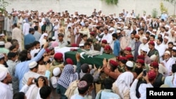 Mourners attend the funeral of a soldier who was killed after separatist insurgents attacked a luxury hotel in the port city of Gwadar on May 13.