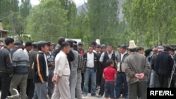 Residents of the village of Sogment gather at the Kyrgyz-Uzbek border. Political tensions often mean that enclave residents are cut off from the wider world.