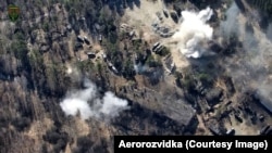 Explosions of Russian military vehicles filmed by an Aerorozvidka drone.