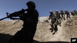 Commandos of the Afghan National Army undergo training by U.S. forces near Kabul in 2011.