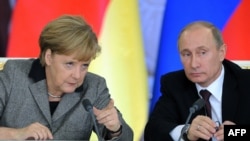 German Chancellor Angela Merkel and Russian President Vladimir Putin in Moscow on November 16.