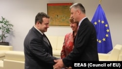 Kosovar Prime Minister Hashim Thaci, EU High Representative Catherine Ashton, and Serbian Prime Minister Ivica Dacic (right to left) in Brussels on May 21