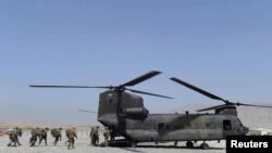 U.S. soldiers board a military Chinook helicopter similar to the one that went down in Maidan Wardak, west of Kabul, on August 5 or 6.