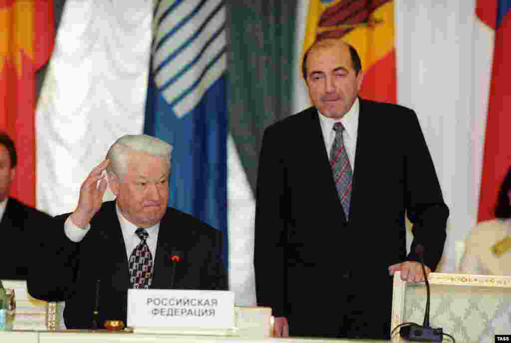 Then-Russian President Boris Yeltsin (left) with CIS Executive Secretary Boris Berezovsky at a CIS summit in Moscow on April 29, 1998.